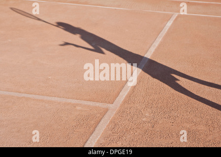 Ombra di persona giocando a tennis Foto Stock