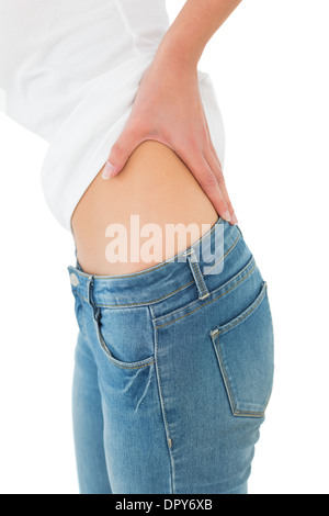 La sezione centrale di una donna che soffriva di dolori alla schiena Foto Stock