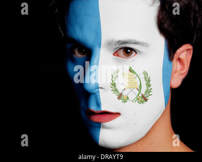 Bandiera del Guatemala dipinta su una faccia di un giovane uomo Foto Stock