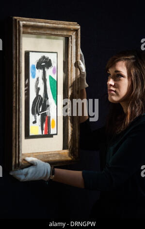London, Regno Unito - 30 Gennaio 2014: un membro del personale pone accanto a 'Femme étoile (1978)' di Joan Miro (set £180.000-220.000) che sarà in vendita il 4 Febbraio presso Bonhams. Credito: Piero Cruciatti/Alamy Live News Foto Stock
