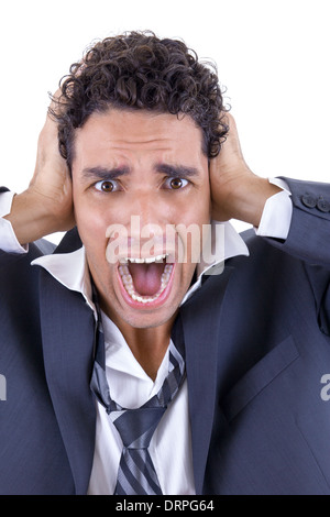 Uomo adulto in tuta business tenendo la sua testa e urlando Foto Stock