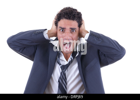 Uomo in business suit tenendo la sua testa e urlando Foto Stock