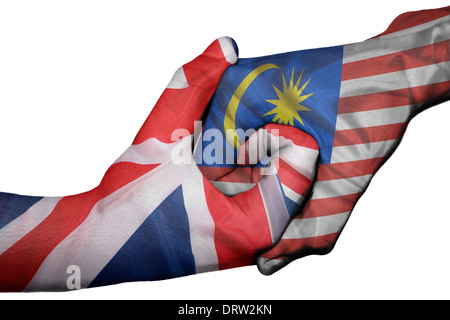 Handshake diplomatiche tra paesi: bandiere del Regno Unito e della Malaysia sovradipinta le due mani Foto Stock