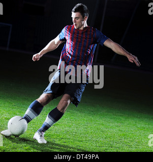 Giocatore di football in azione Foto Stock