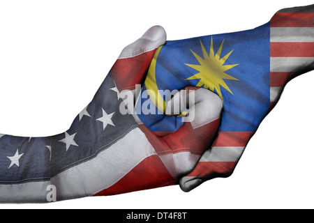 Handshake diplomatiche tra paesi: bandiere degli Stati Uniti e della Malaysia sovradipinta le due mani Foto Stock
