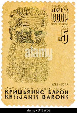 Unione Sovietica - circa 1985: timbro stampato in Unione Sovietica, mostra ritratto di Krishianis Baron (1835-1923), lettone di manifestazioni folcloristiche Foto Stock
