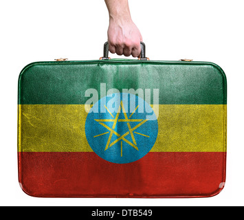 Tourist mano azienda pelle vintage borsa da viaggio con bandiera di Etiopia Foto Stock