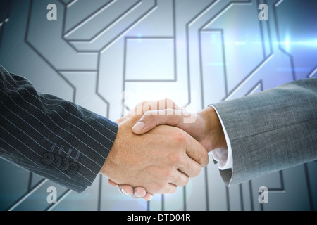 Immagine composita di handshake business contro la scheda di circuito Foto Stock