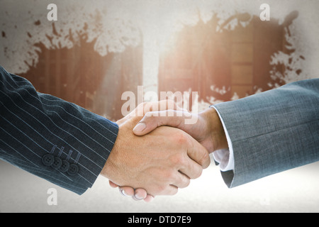 Immagine composita di handshake business sullo sfondo Foto Stock