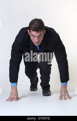 Business man sul blocco di partenza Foto Stock