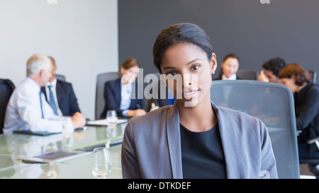 Business donna seduta in riunione Foto Stock