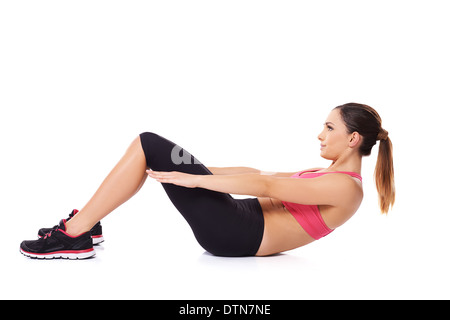 Donna facendo sit ups Foto Stock