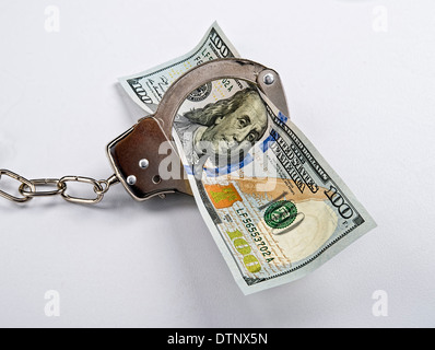 Contanti duri freddi in freddo acciaio manette. Foto Stock