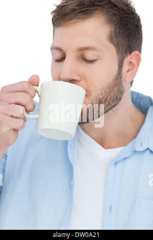 Modello casuale di bere un caffè Foto Stock