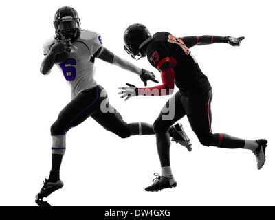 Due american football giocatori in silhouette ombra su sfondo bianco Foto Stock
