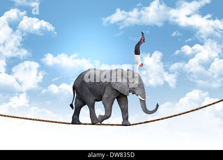 L'uomo su acrobat elephant concetto astratto Foto Stock