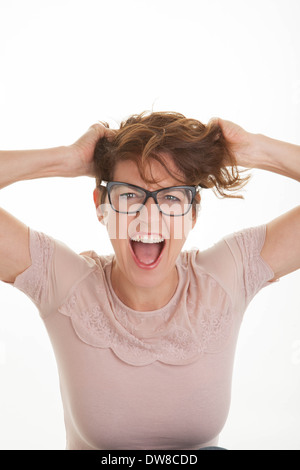 Frustrati donna con le mani alla testa Foto Stock