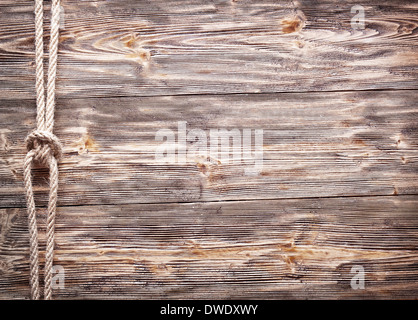 Sailor's nodo su un vecchio sfondo di legno. Foto Stock