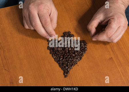 Spade e chicco di caffè Foto Stock