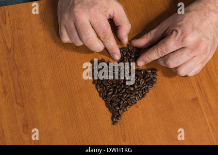 Spade e chicco di caffè Foto Stock