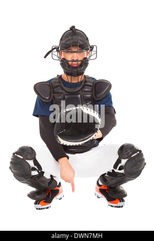 Giocatore di baseball , catcher che mostra un segnale segreto gesto isolato su bianco Foto Stock