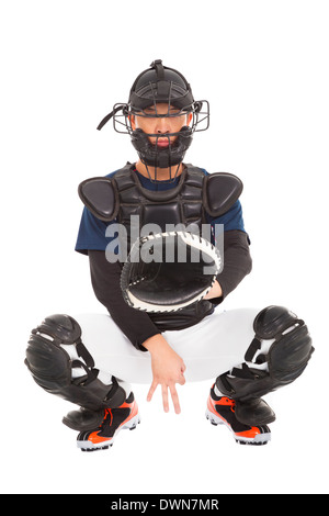 Giocatore di baseball , catcher mostra segnale segreto gesto su bianco Foto Stock