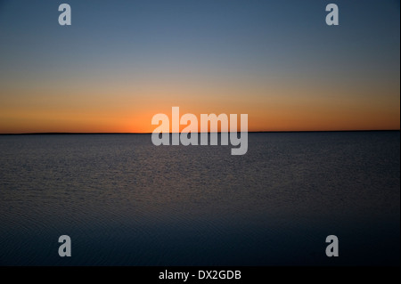 Tramonto su acqua Foto Stock