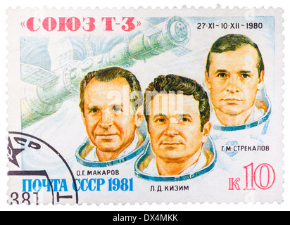 Timbro stampato in URSS mostra i cosmonauti sovietici Makarov, Kizim, Strekalov e un trasporto astronave 'Soyuz-T3', circa 1980 Foto Stock