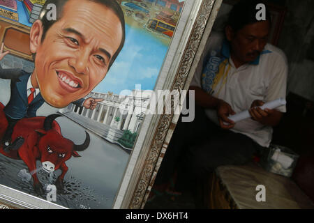 Jakarta, DKI Jakarta, Indonesia. Xix Mar, 2014. Un dipinto di Giacarta governatore Joko Widodo, chi è in esecuzione per il presidente per il Partito Democratico Indonesiano di Lotta (PDI-P) display a Street Painting Shop venditore in Jakarta. Marzo 19, 2014. Indonesia, il più grande del mondo a maggioranza musulmana con 250 milioni di persone, terrà i sondaggi legislativa nei mesi di aprile e di eleggere un nuovo presidente in luglio, con alcuni 180 milioni di elettori ammessi a partecipare. Credito: Jeff Aries/ZUMAPRESS.com/Alamy Live News Foto Stock