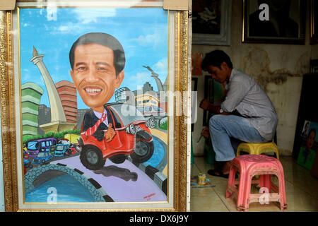 Jakarta, DKI Jakarta, Indonesia. Xix Mar, 2014. Un dipinto di Giacarta governatore Joko Widodo, chi è in esecuzione per il presidente per il Partito Democratico Indonesiano di Lotta (PDI-P) display a Street Painting Shop venditore in Jakarta. Marzo 19, 2014. Indonesia, il più grande del mondo a maggioranza musulmana con 250 milioni di persone, terrà i sondaggi legislativa nei mesi di aprile e di eleggere un nuovo presidente in luglio, con alcuni 180 milioni di elettori ammessi a partecipare. Credito: Jeff Aries/ZUMAPRESS.com/Alamy Live News Foto Stock