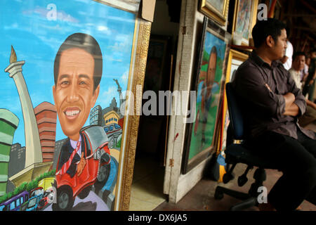 Jakarta, DKI Jakarta, Indonesia. Xix Mar, 2014. Un dipinto di Giacarta governatore Joko Widodo, chi è in esecuzione per il presidente per il Partito Democratico Indonesiano di Lotta (PDI-P) display a Street Painting Shop venditore in Jakarta. Marzo 19, 2014. Indonesia, il più grande del mondo a maggioranza musulmana con 250 milioni di persone, terrà i sondaggi legislativa nei mesi di aprile e di eleggere un nuovo presidente in luglio, con alcuni 180 milioni di elettori ammessi a partecipare. Credito: Jeff Aries/ZUMAPRESS.com/Alamy Live News Foto Stock