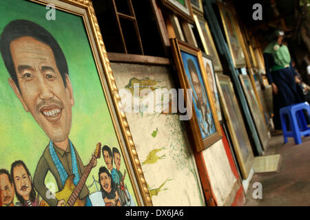 Jakarta, DKI Jakarta, Indonesia. Xix Mar, 2014. Un dipinto di Giacarta governatore Joko Widodo, chi è in esecuzione per il presidente per il Partito Democratico Indonesiano di Lotta (PDI-P) display a Street Painting Shop venditore in Jakarta. Marzo 19, 2014. Indonesia, il più grande del mondo a maggioranza musulmana con 250 milioni di persone, terrà i sondaggi legislativa nei mesi di aprile e di eleggere un nuovo presidente in luglio, con alcuni 180 milioni di elettori ammessi a partecipare. Credito: Jeff Aries/ZUMAPRESS.com/Alamy Live News Foto Stock