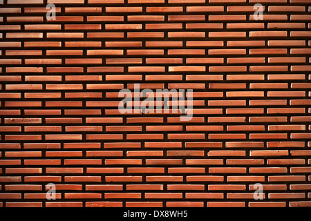 Sullo sfondo di un mattone rosso modello a parete Foto Stock