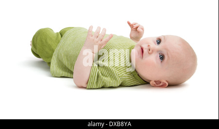 Il toddler nel verde di abbigliamento recante sul retro in sfondo bianco Foto Stock
