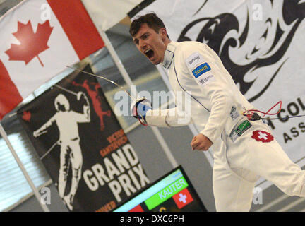 Vancouver, Canada. 23 Mar, 2014. Fabian Kauter della Svizzera reagisce dopo la vittoria del 2014 Vancouver uomini Epee Grand Prix campionato di scherma in Richmond, Canada, 23 marzo 2014. Egli ha sconfitto il campione del mondo Nikolai Novosjolov dell'Estonia in finale e ha vinto la medaglia d'oro. © Sergei Bachlakov/Xinhua/Alamy Live News Foto Stock