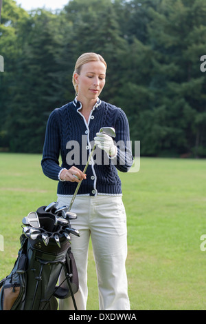 Donna sul campo da golf Foto Stock