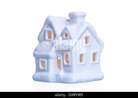 In ceramica bianca casa di souvenir con incandescente windows Foto Stock