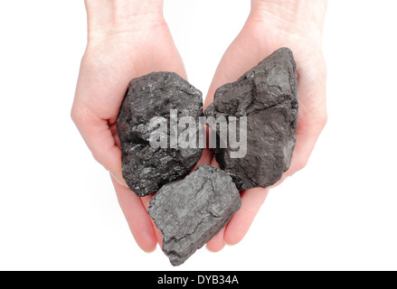 Donna di mano con grumi di carbone su sfondo bianco Foto Stock