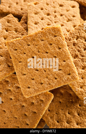 Miele di sani Graham cracker su una piastra Foto Stock