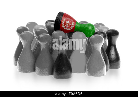 Un unica pedina sulla parte superiore delle pedine comune bandiera dell'Afghanistan Foto Stock