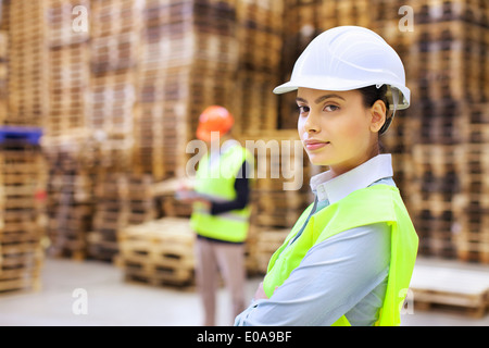 Portrait of female supervisor in distribution warehouse Foto Stock