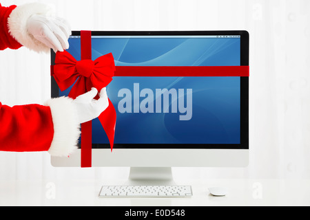 Babbo Natale arco di legatura sul computer Foto Stock