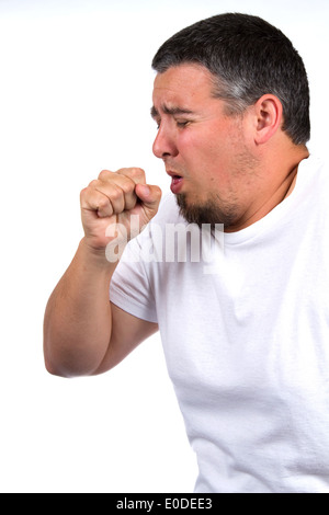 Malati maschio adulto tossisce in pugno. Foto Stock