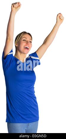 Il tifo appassionato di calcio in maglia blu Foto Stock