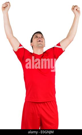 Eccitato giovane calciatore tifo Foto Stock