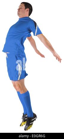 Giocatore di football in blu jumping Foto Stock