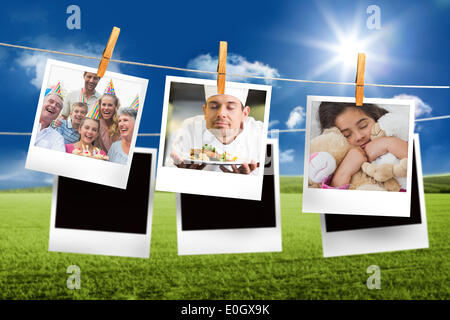 Immagine composita della foto istantanea appeso su una linea Foto Stock