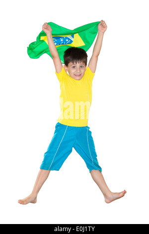 Ragazzo brasiliano, saltando, tenendo bandiera brasiliana Foto Stock