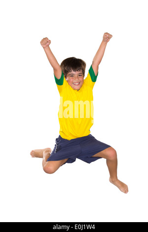 Ragazzo brasiliano, saltando, giallo e blu Foto Stock