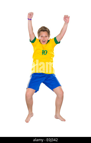 Ragazzo brasiliano, saltando, giallo e blu Foto Stock